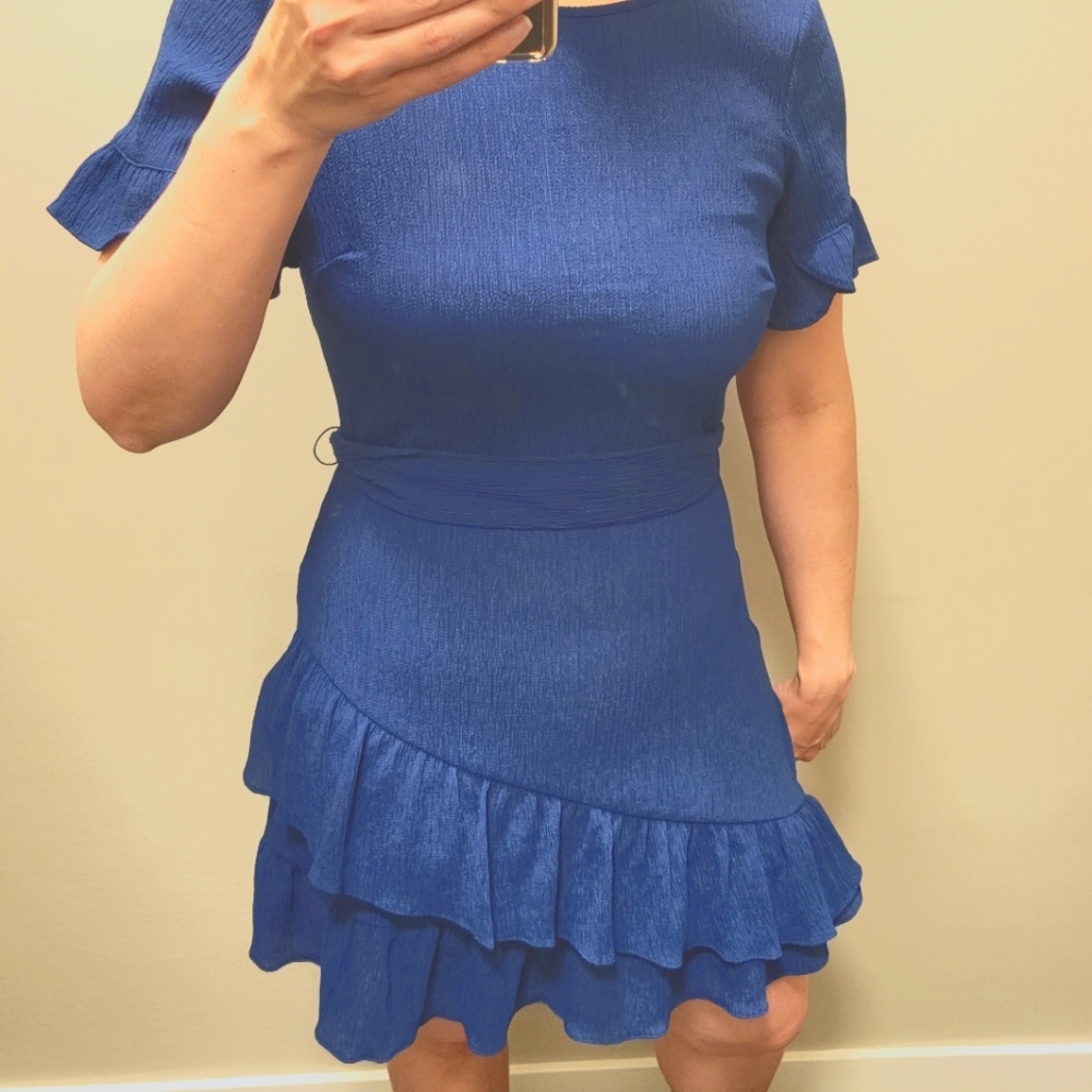 Blue ruffle dress. Banana Republic. Brand new. Size 8. Machine washable.